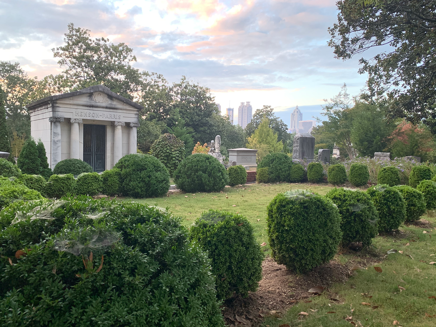 Mausoleum at Oakland Cemetery with Atlanta city skyline in background