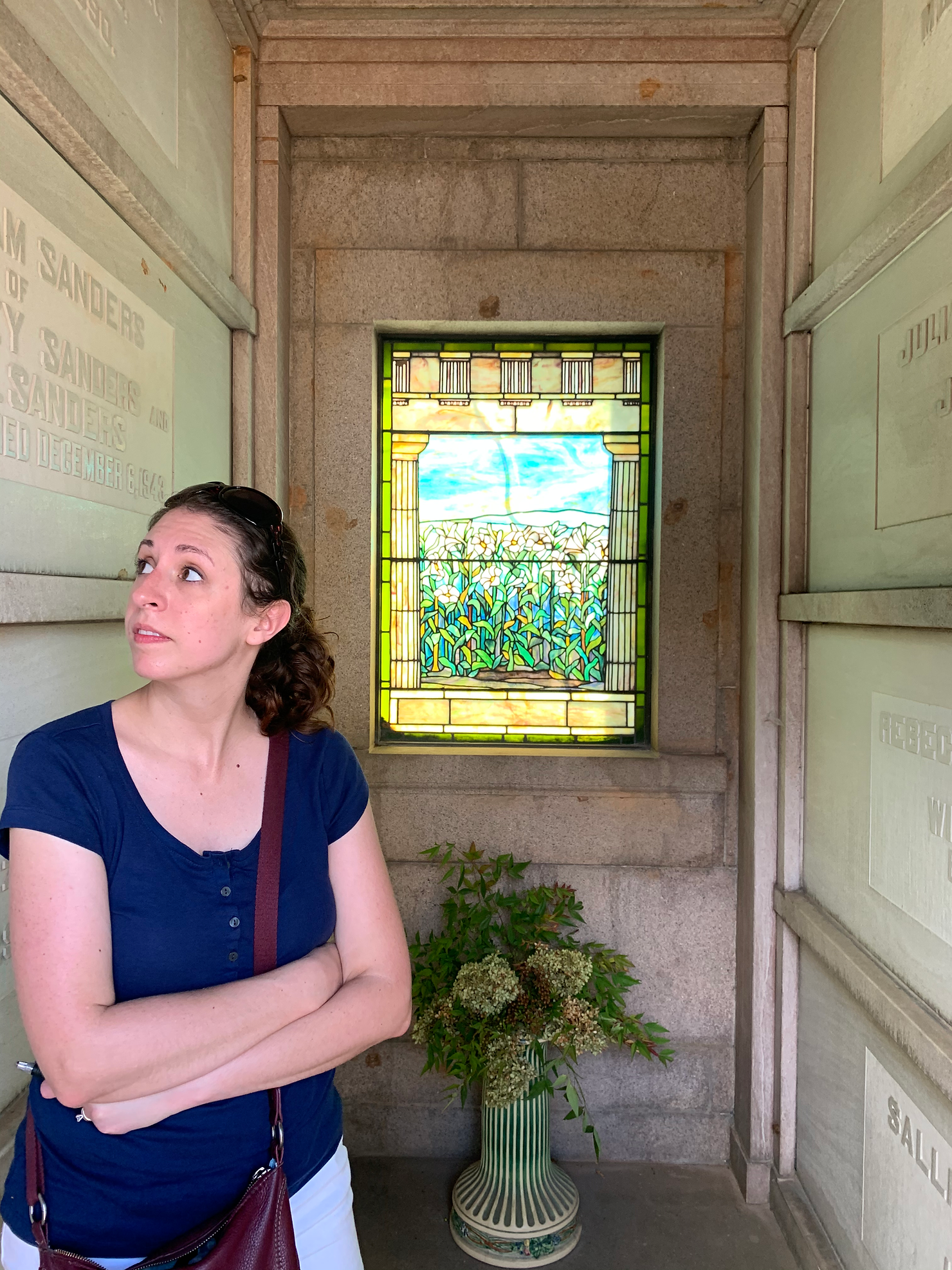 Visitor Explores Mausoleum Interior at Oakland Cemetery in Atlanta