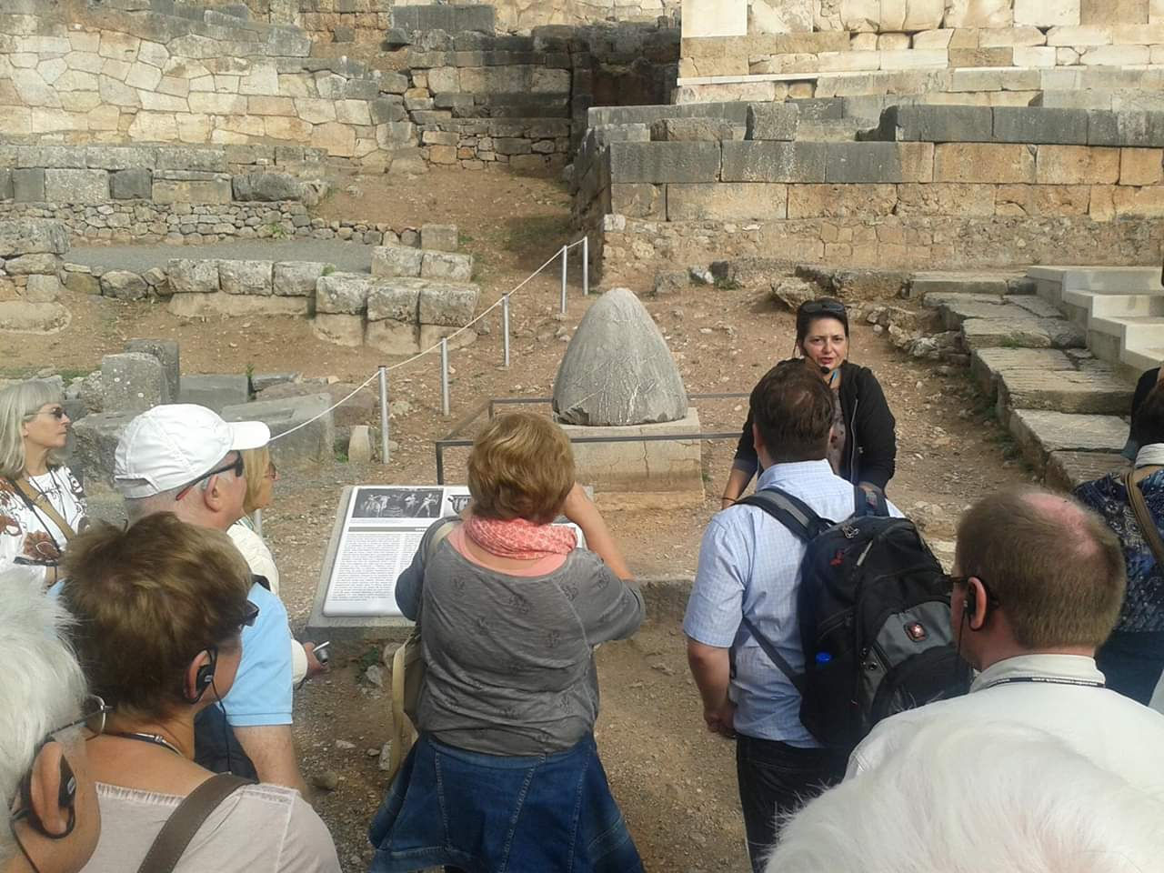 Efi Kalampoukidou Greece Guide at the Sacred Omphalos Stone